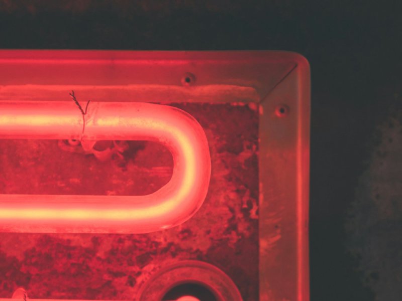 Red-glowing electric resistance heating element inside a metal appliance housing