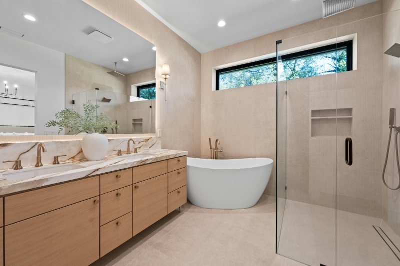 Bathroom with both a freestanding tub and a separate glass shower